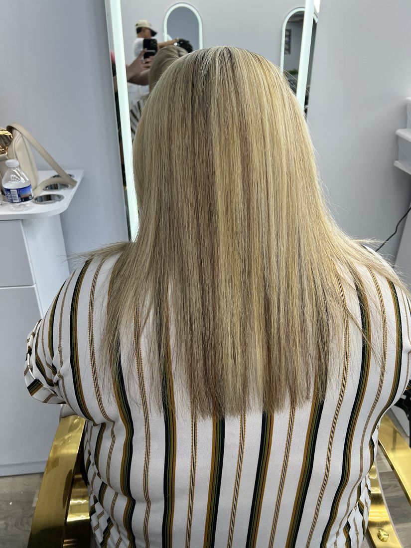 Blonde highlights, sleek straight finish